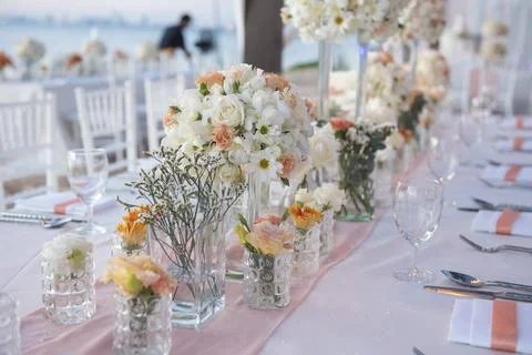Wedding The elegant dinner table on the beach Stock Photos