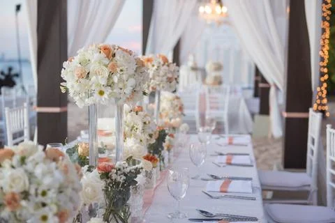 Wedding The elegant dinner table on the beach Stock Photos