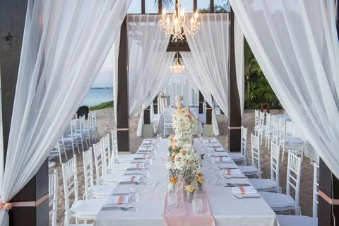 Wedding The elegant dinner table on the beach Stock Photos