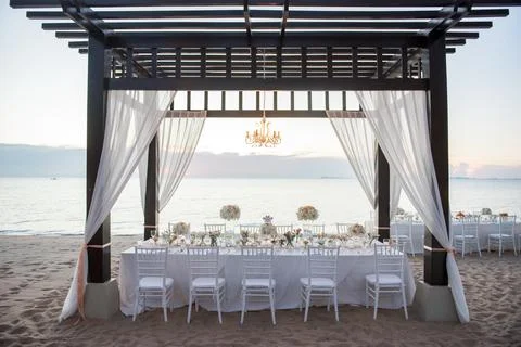 Wedding The elegant dinner table on the beach Stock Photos