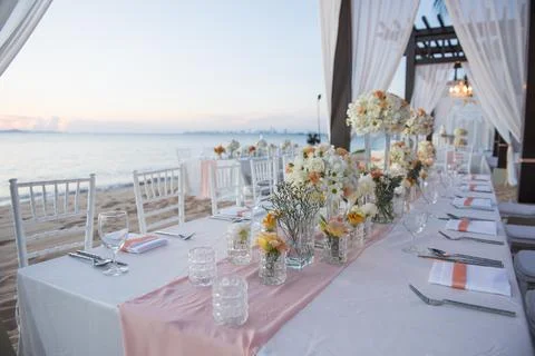 Wedding The elegant dinner table on the beach Stock Photos