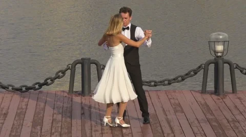Wedding first dance of bride and groom on dock Stock Footage 67619349