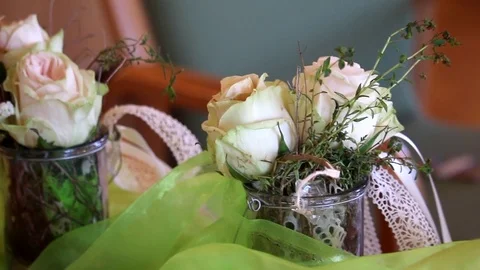 Wedding flower decoration on a table white roses in a glass Stock Footage 71204307