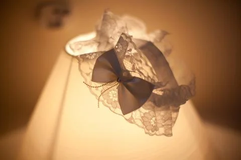 Wedding garter lace on lamp Stock Photos