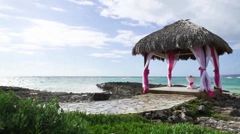 Wedding gazebo on the ocean reef shore Stock Footage 50635899