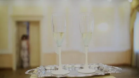 Wedding glasses of champagne stand on the table Stock-Footage 328370466