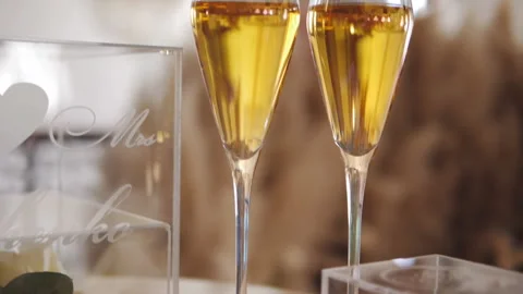 Wedding glasses with champagne on the table of the host of the wedding ceremony. Stock Footage 149819317