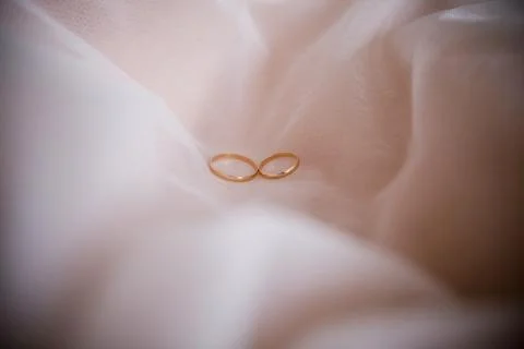 Wedding gold rings on the table Stock Photos