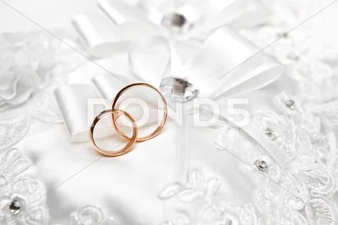 Wedding Gold Rings On A White Pillow