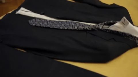 Wedding groom suit on bed Stock Footage 62825924