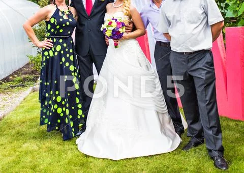 Wedding Guests With Bride And Groom