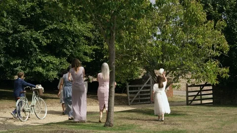 Wedding guests heading for gate Stock Footage 129913029