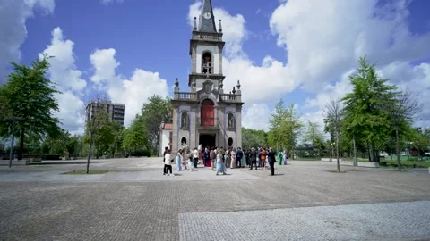 Wedding Guests Waiting Outside Catholic Church on a Sunny Day Stock Footage 307300932