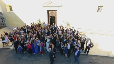 Wedding guests waving to the drone Stock Video Pond5