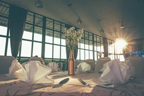 Wedding hall or other function facility set for fine dining and sun light. Stock Photos