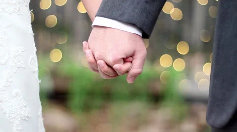 Wedding hand hold bokeh Stock-Footage 26179145