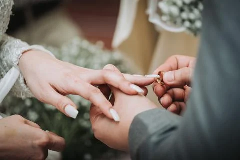 Wedding hands ring inserting 写真素材
