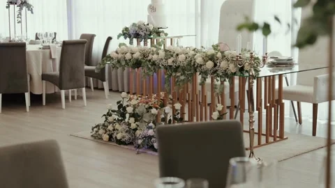 Wedding Head Table with White Floral Runner and Candelabra in a Banquet Hall Stock Footage 344013376