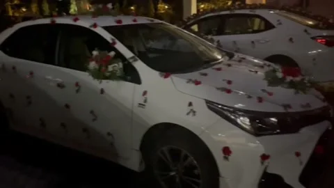 Wedding Heart Shape Flower On Car, decorative flower on a white car Stock Footage 199144367