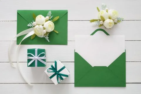 Wedding invitation cards or Valentines Day letters in green envelopes  Stock Photos