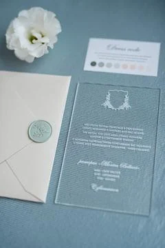 Wedding invitation in a gray envelope on a table Stock Photos