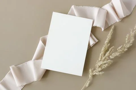 Wedding invitation mockup, empty blank card mock up with white silk ribbon and d Stock Photos