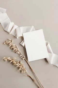 Wedding invitation mockup, empty blank card mock up with white silk ribbon and d Stock Photos