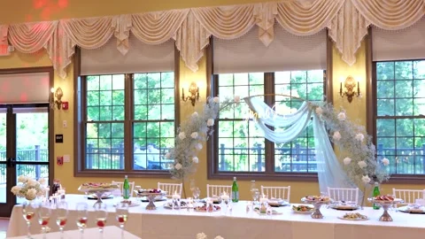 Wedding jewelry. Wedding table with plates, chairs, napkins, decorative fresh Stock Footage 294956629