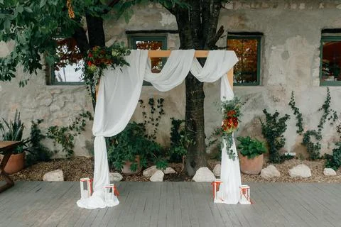 Wedding location. simple rustic decorated wedding arch Stock Photos