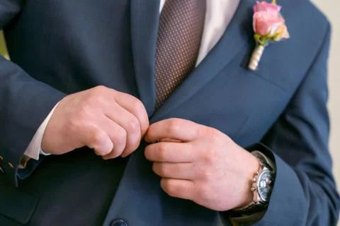 Wedding men's hands button up Stock Photos