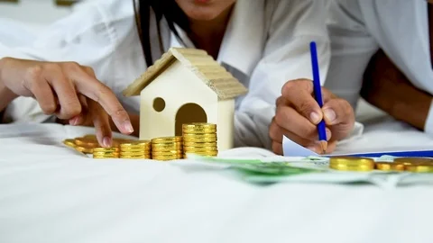 Wedding money saving finance solution planning wealth family. Hands of couple lo Stock-Footage 124739229