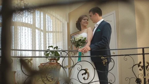 Wedding morning. First meeting of bride and groom in the bridal apartments Stock Footage