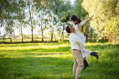 Wedding. A pair of lovers in a pine forest. The bride and groom are dancing,  Stock Photos
