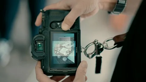 Wedding photographer looking through the camera screen shots Stock Footage 224866987