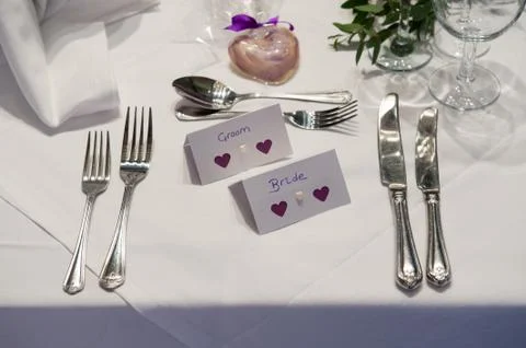 Wedding place setting for bride and groom Stock Photos