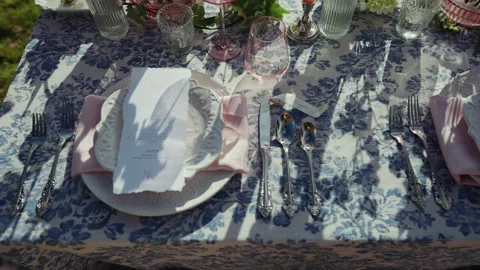 Wedding place settings with menu cards and silverware overhead Stock-Footage 347969080
