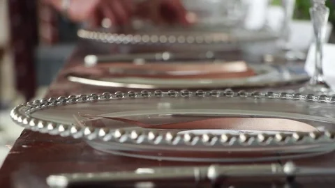 Wedding planner, preparing festive table, dishes and cutlery in wedding day Stockbeeldmateriaal 70588144