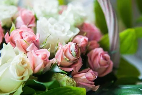 Wedding precious ring of the bride and groom in a chic bouquet of flowers Stock Photos