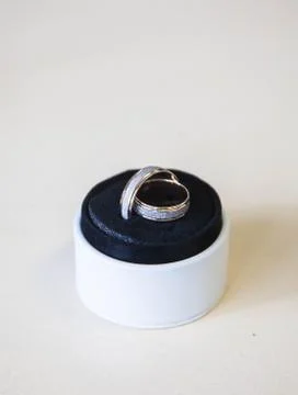 Wedding precious ring of the bride and groom in a gift box Stock Photos