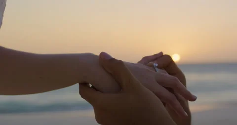 Wedding-proposal-ring-sunset-beach Stock Footage