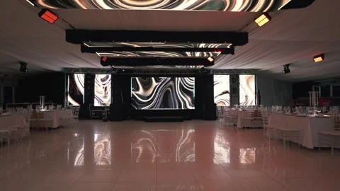 Wedding Reception Dinner Setting In Modern Event Hall With Large LED Screens On Stock Footage 328693839