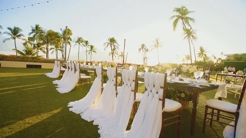 Wedding reception set outdoors under bright sun on resort hyatt,island maui Stock Footage 101117382