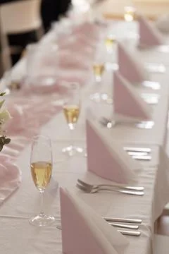 Wedding reception table setup with champagne flutes Stock Photos