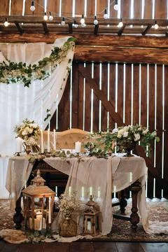 Wedding reception. The wedding table is decorated with fresh flowers and cand Stock Photos