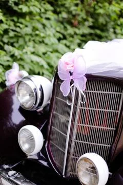 Wedding retro car decoration with ribbons and ornaments Stock Photos