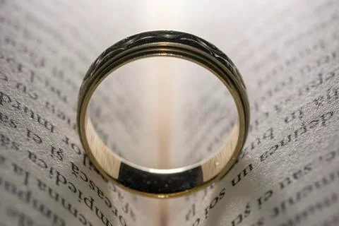 Wedding ring on book Stock Photos