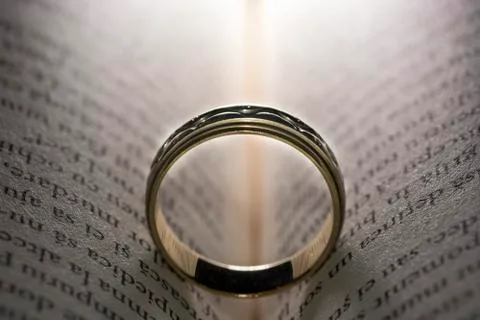Wedding ring on book Stock Photos