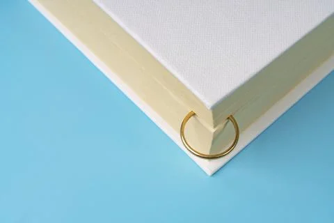 A wedding ring in the book Stock Photos