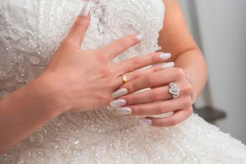 Wedding ring with bridal hand Stock Photos