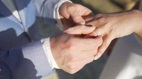 Wedding ring bride and groom holding hands at ceremony,Closeup. Stock Footage 209128849